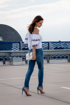 blouse jeans and sneakers